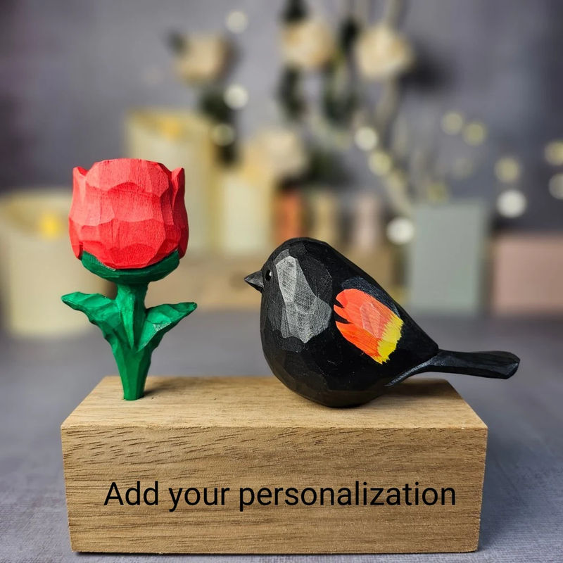 Red-winged Blackbird with Rose